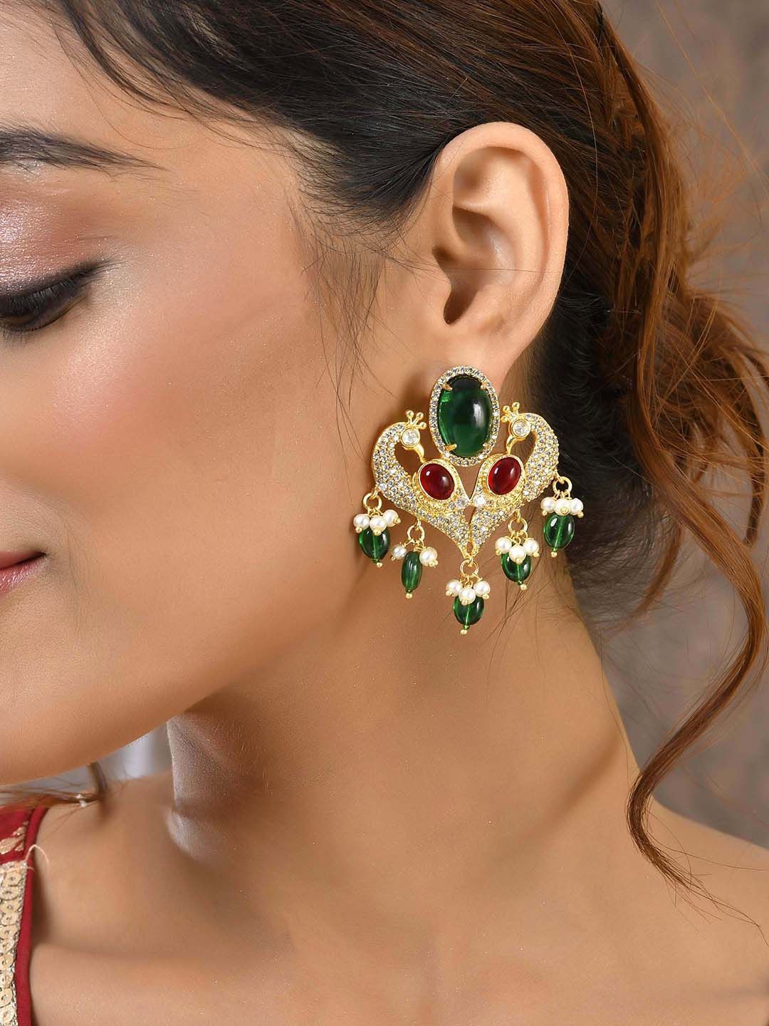 

Voylla Gold Plated Kundan Studded Peacock Shaped Drop Earrings