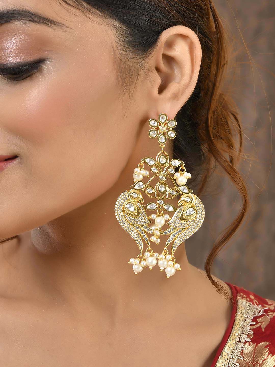 

Voylla Gold Plated Kundan Studded Peacock Shaped Drop Earrings