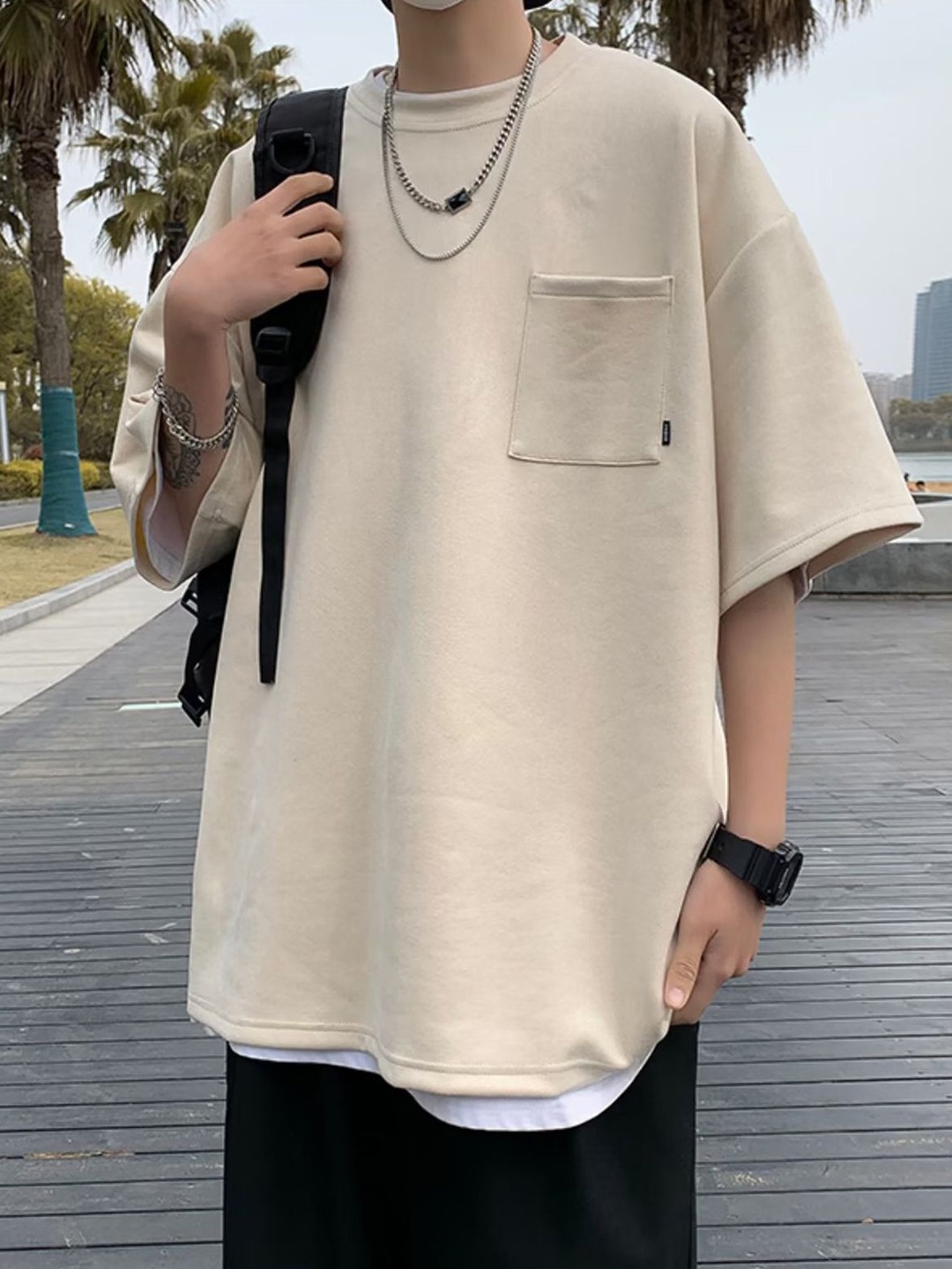 

StyleCast x Revolte Men Solid Round Neck Oversized T-shirt, Beige