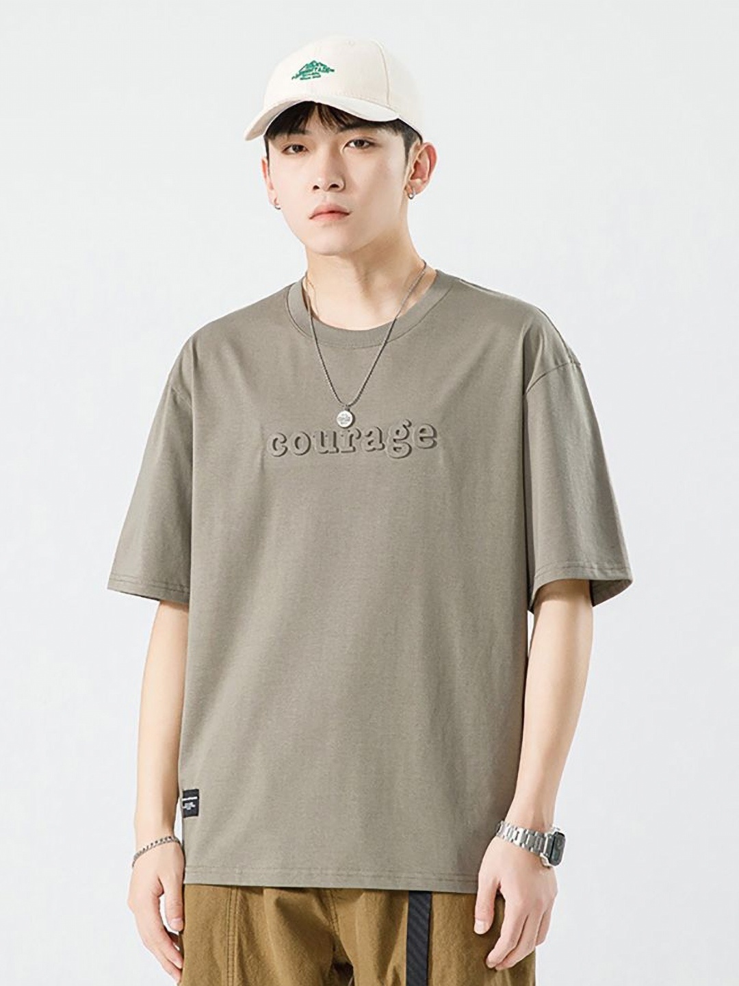 

StyleCast x Revolte Men Typography Printed Round Neck Cotton Relaxed Fit T-shirt, Brown
