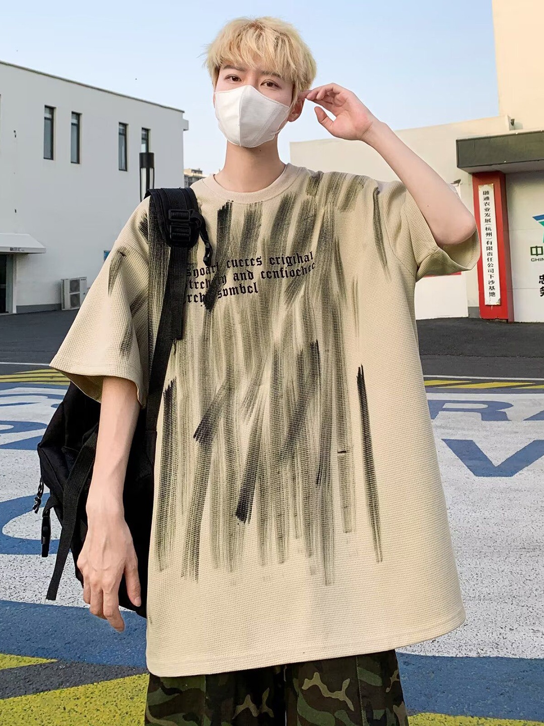 

StyleCast x Revolte Men Typography Printed Round Neck Oversized T-shirt, Beige