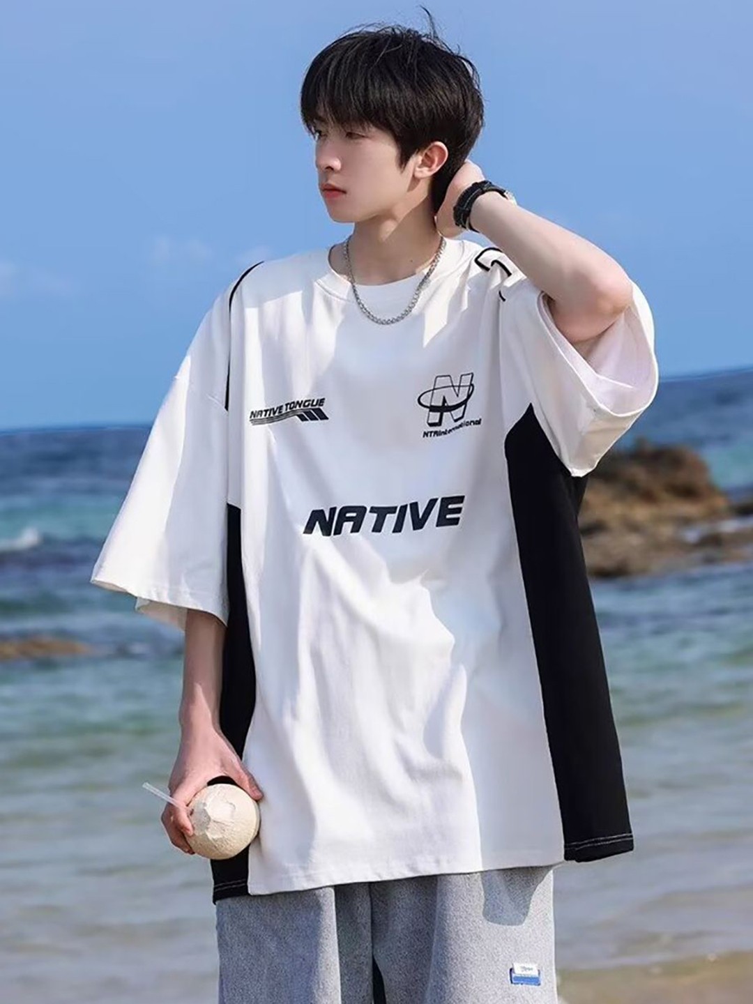 

StyleCast x Revolte Men Graphic Printed Round Neck Oversized T-shirt, White