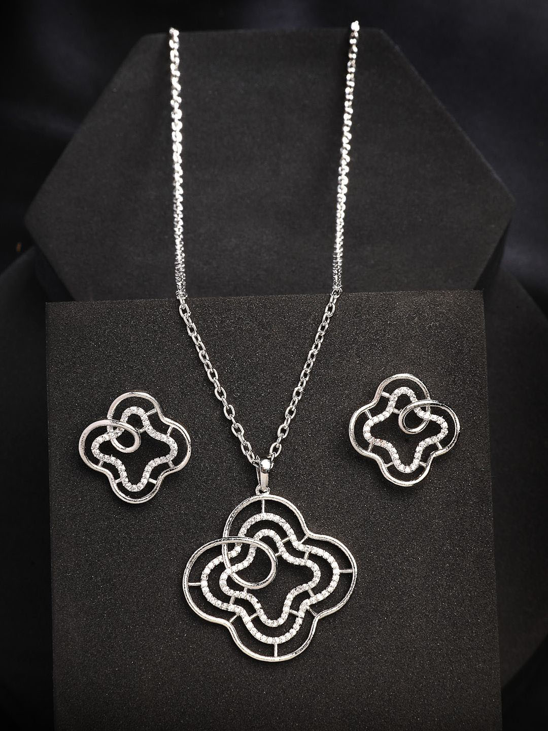 

ZENEME Rhodium Plated Floral Embellished Endless Bond Pendant With Earrings Set, Silver