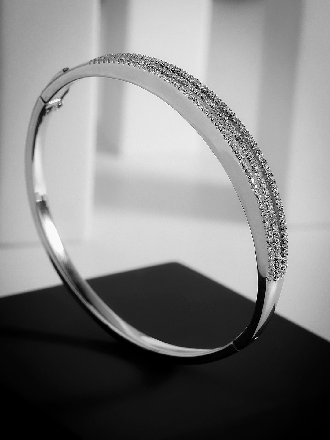

DIAVO Dazzling Tiered Rhodium-Plated Silver Cubic Zirconia Bangle-Style Bracelet