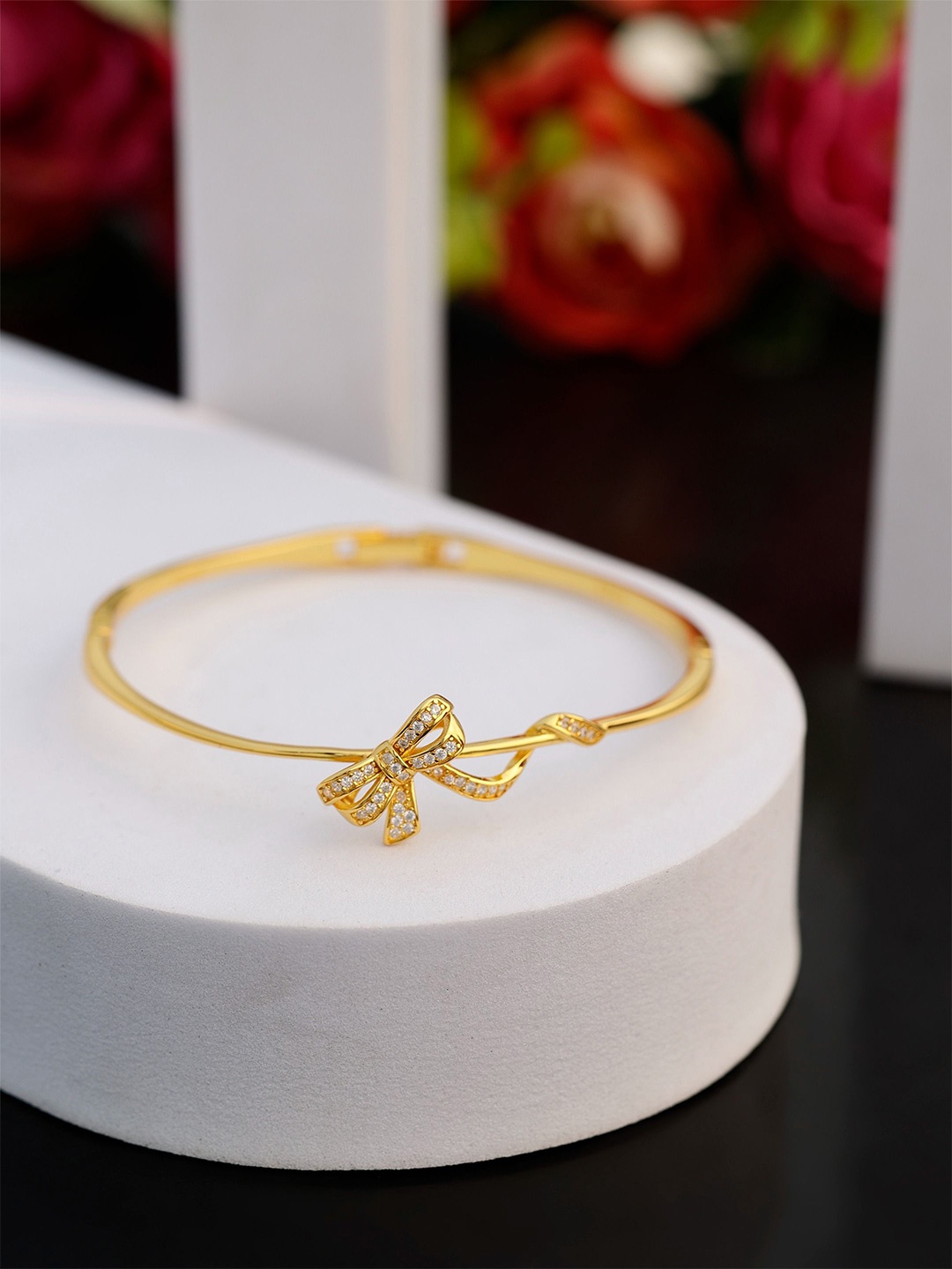 

DIAVO Cubic Zirconia Dazzling Bow Gilded Silver Kada Bracelet, Gold