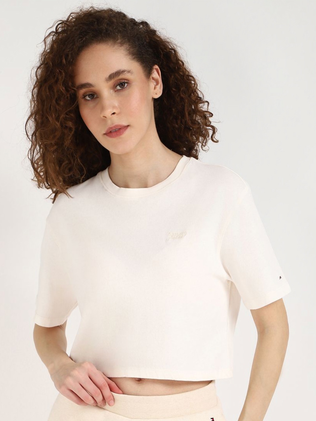 

Tommy Hilfiger Women TJW Solid Round Neck Cotton T-shirt, Off white