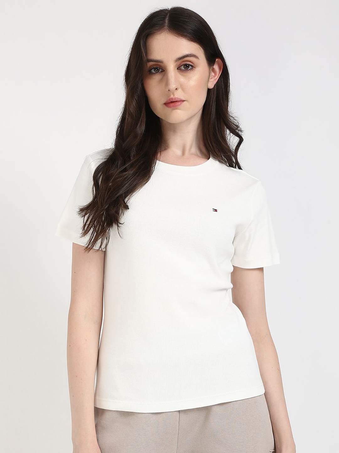 

Tommy Hilfiger Women Solid Round Neck Cotton T-shirt, Off white