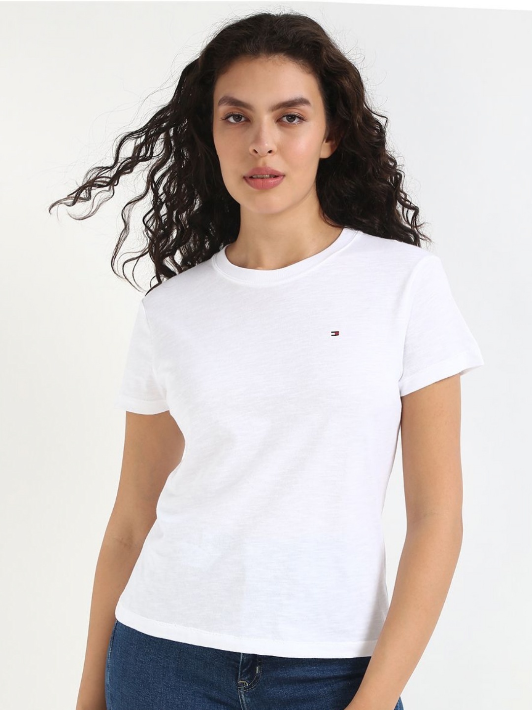 

Tommy Hilfiger Women Solid Round Neck Cotton T-shirt, White