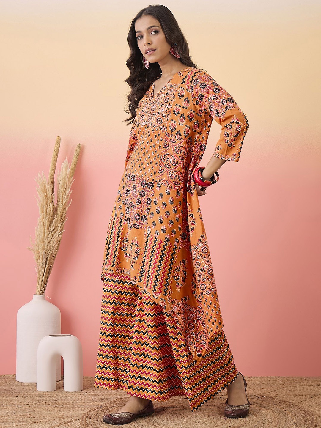 

Sangria Ethnic Motifs Printed V-Neck A-Line Pure Cotton Kurta & Palazzos, Orange