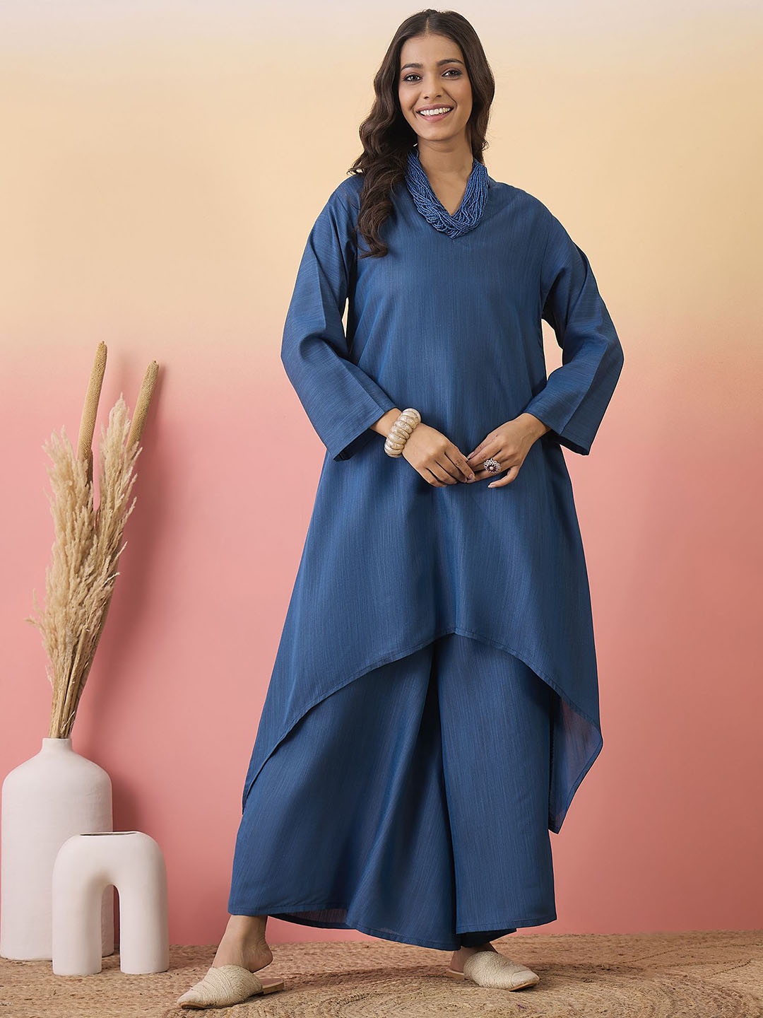 

Sangria Mandarin Collar Flared Sleeve High-Low Kurta and Palazzo, Teal