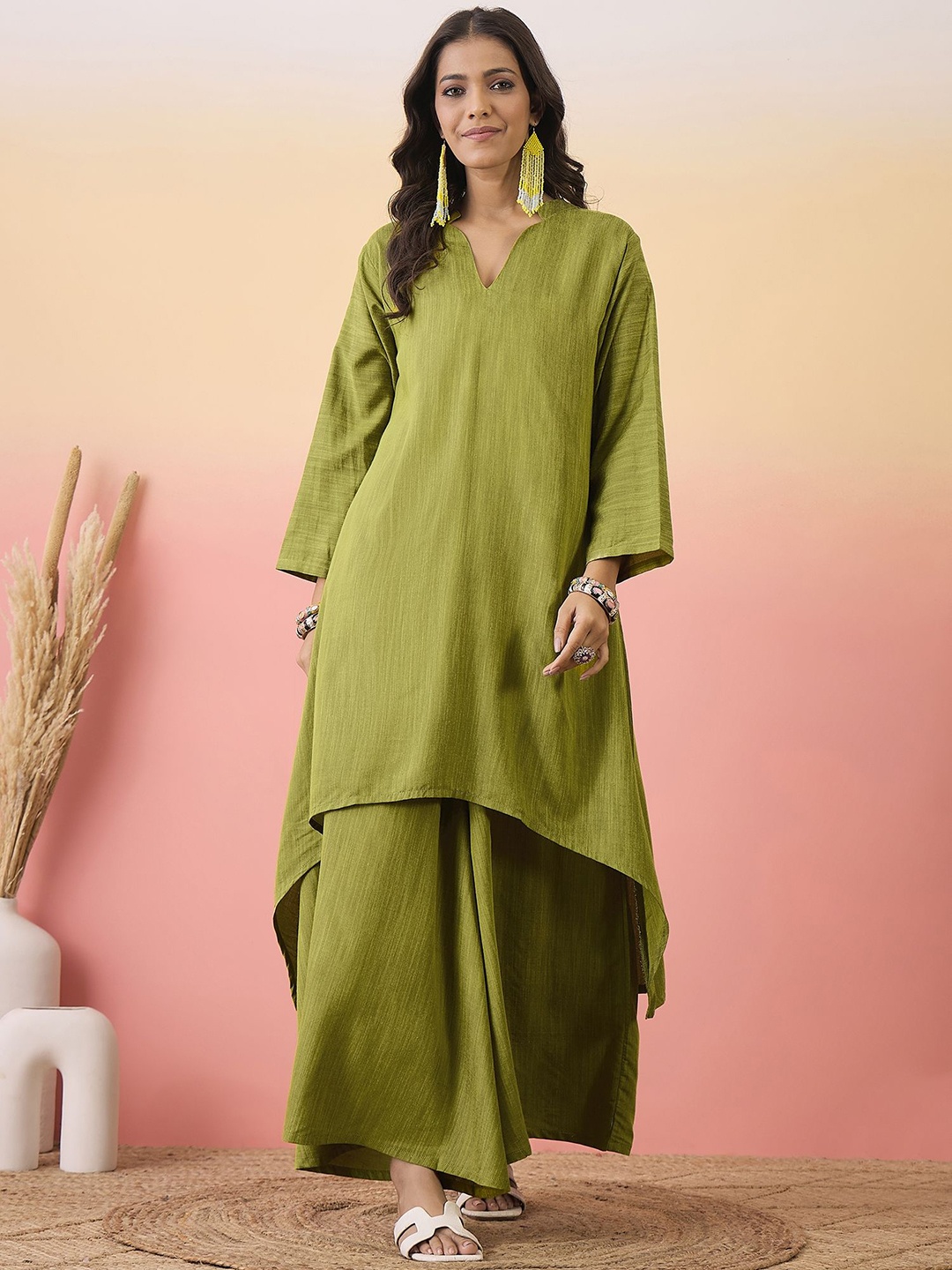 

Sangria Mandarin Collar Flared Sleeve High-Low Kurta and Palazzo, Olive