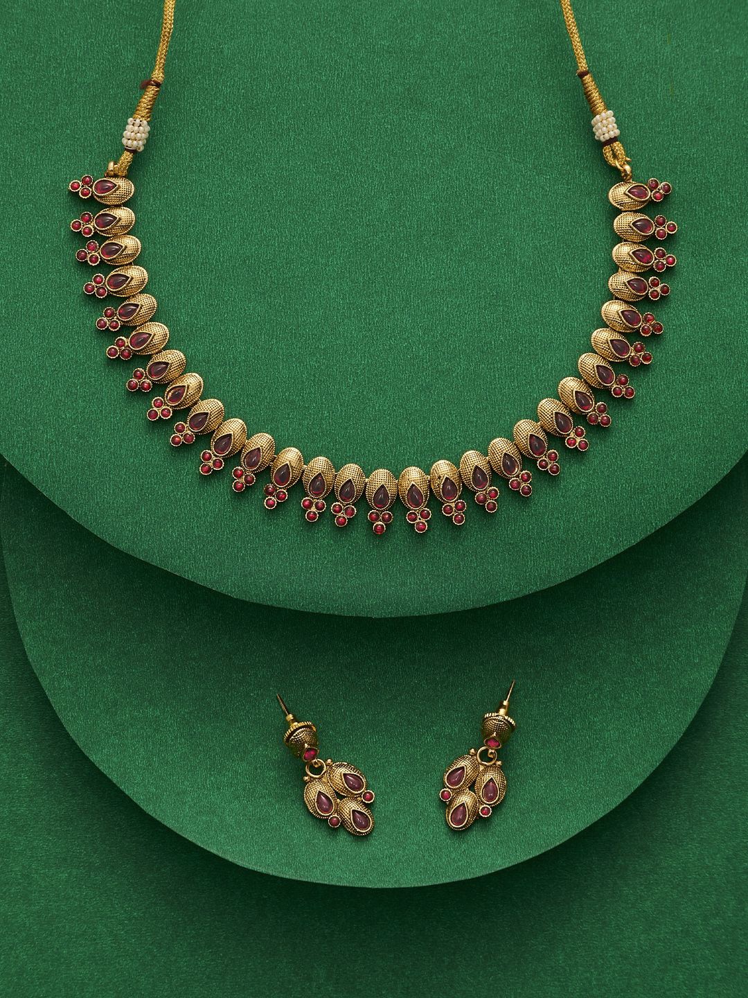 

TEEJH Kashvini Women Gold Plated Ruby Studded Jewellery Set