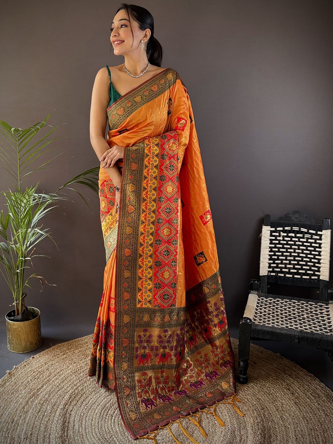 

Panzora Ethnic Motifs Zari Patola Saree With Unstitched Blouse Piece, Orange