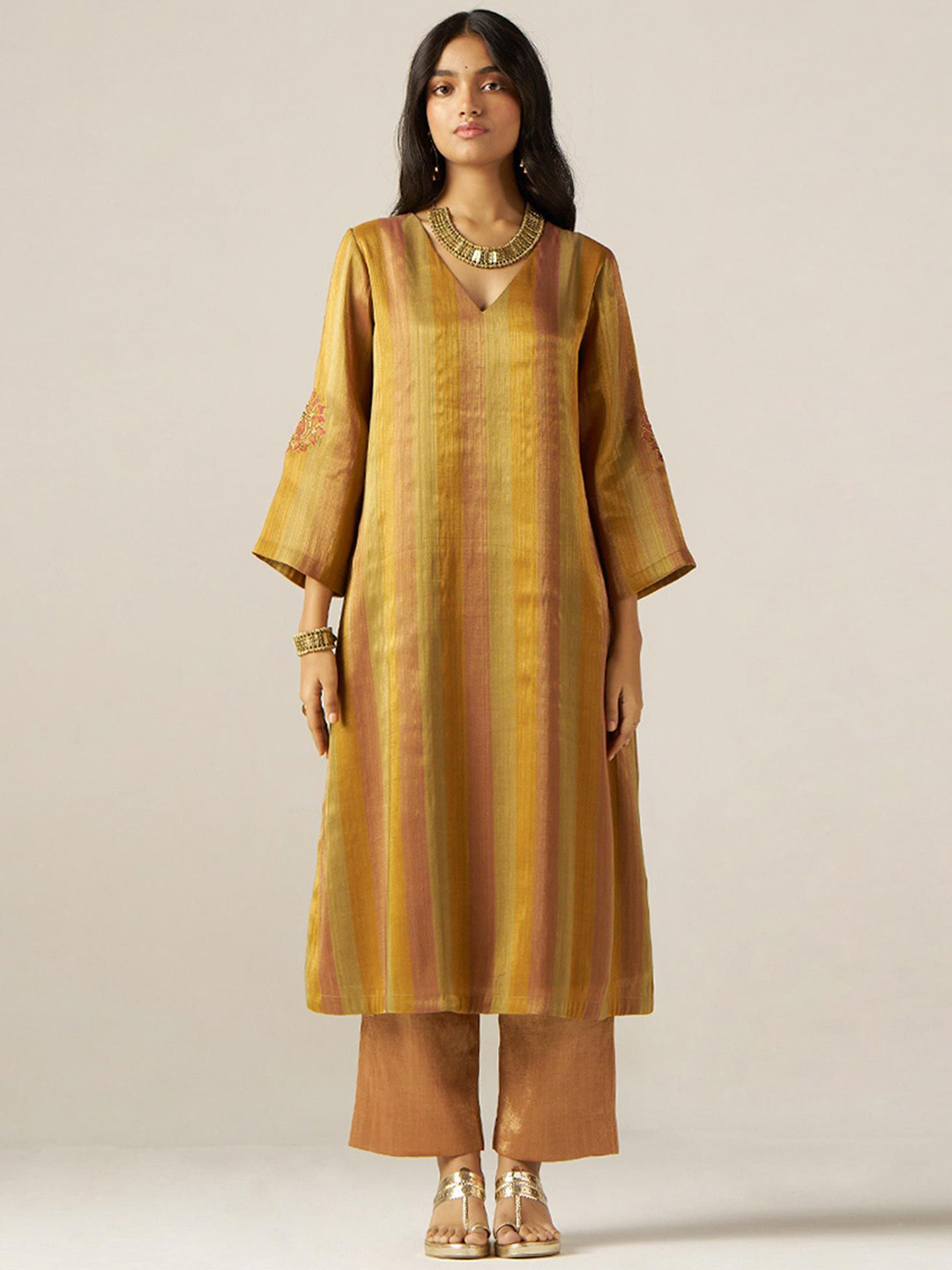 

Ganga Striped V-Neck Thread Work Tissue Straight Kurta With Palazzos, Mustard