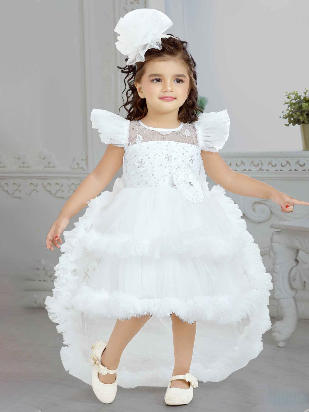 

Lagorii Girls Frill Sleeves And Sequin Embroidery With Floral Embellished Tail Back Frock, White