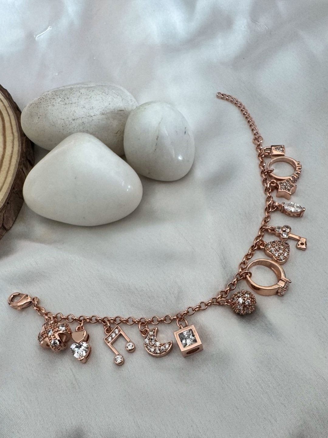 

The Jewellery Tale Rose Gold-Plated American Diamond Stone Studded Charm Bracelet