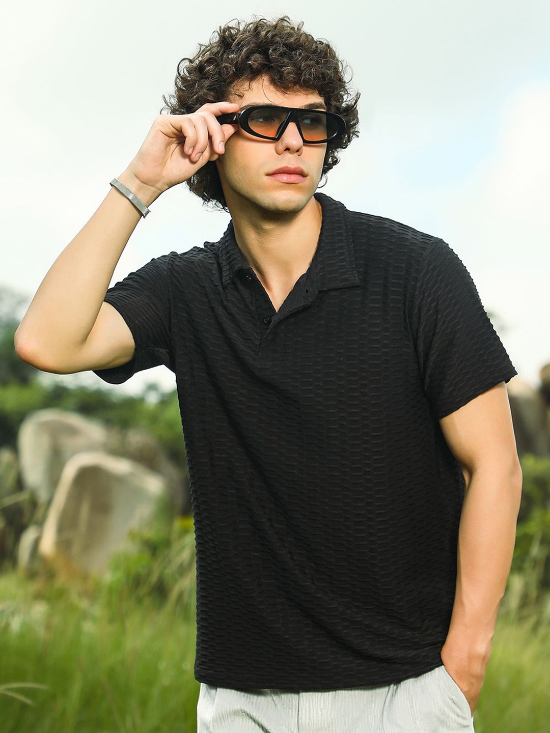 

Campus Sutra Men Self Design Polo Collar Cotton T-shirt, Black