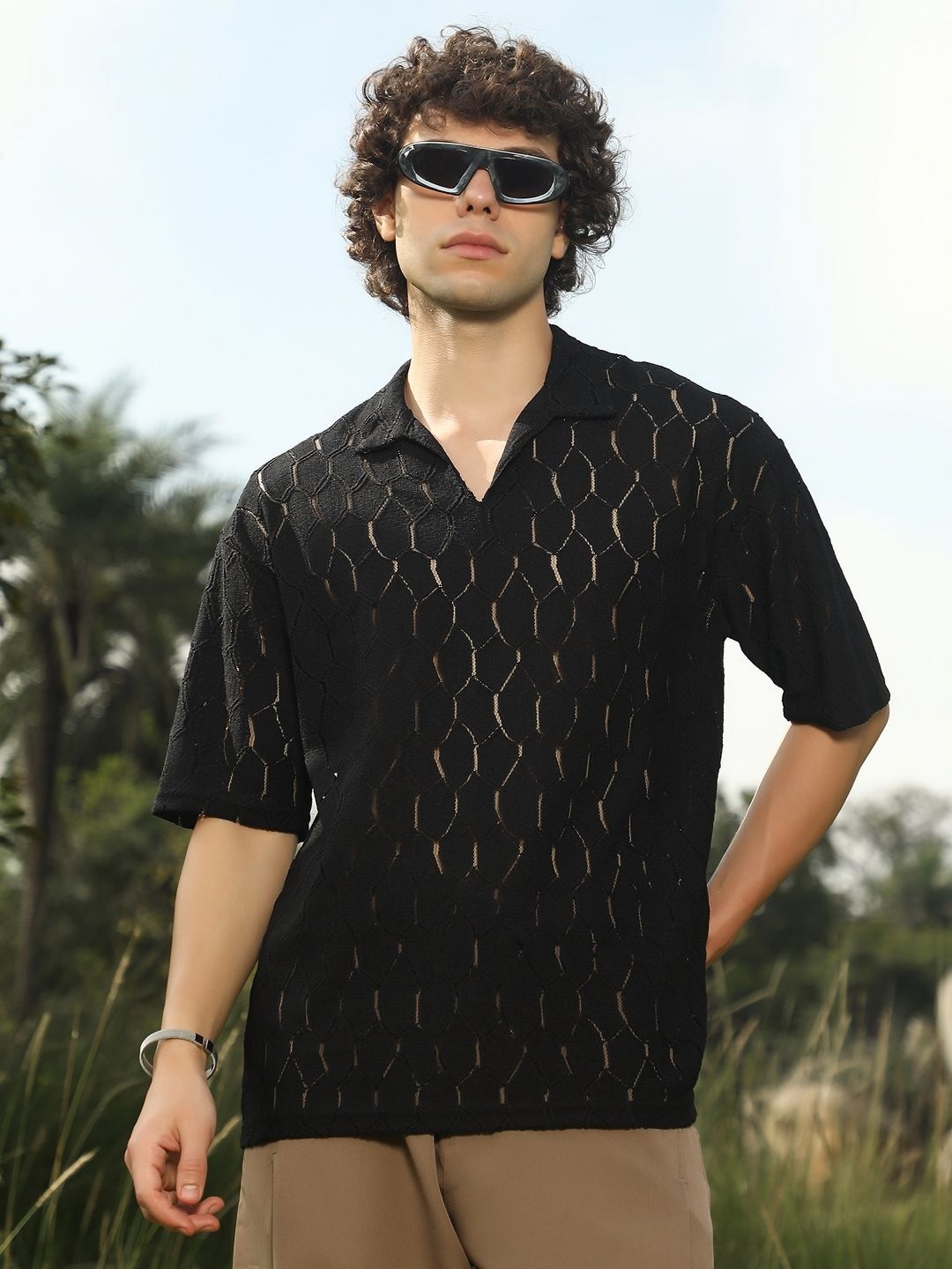

Campus Sutra Men Self Design Polo Collar Cotton T-shirt, Black