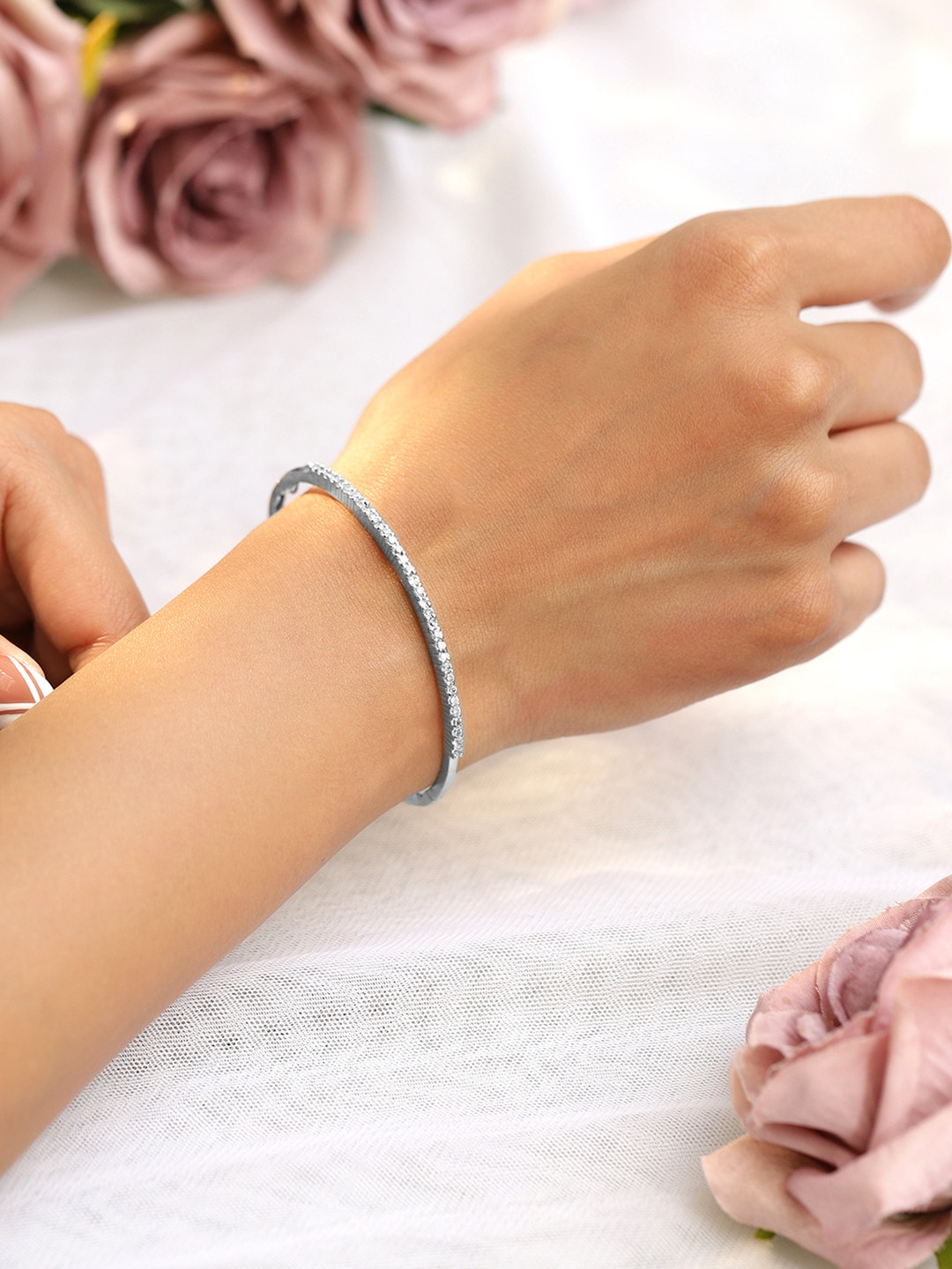 

Rubans Rhodium Plated Cubic Zirconia Bangle Style Bracelet, Silver