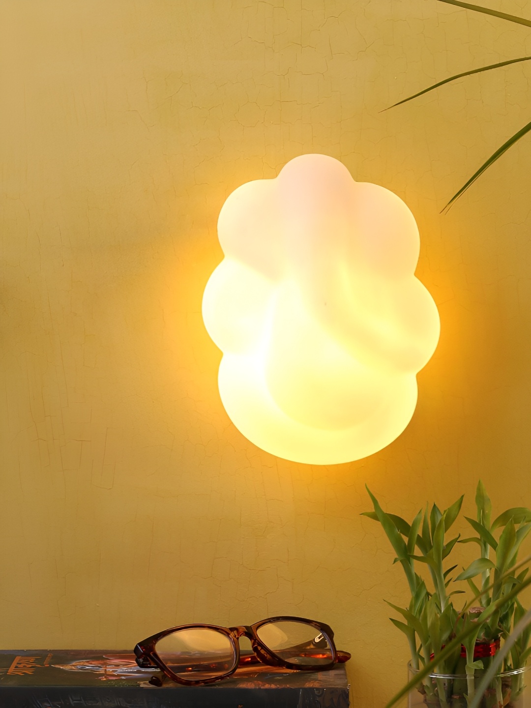 

Aura White Glass Ganesha Traditional Abstract Shaped Wall Lamp