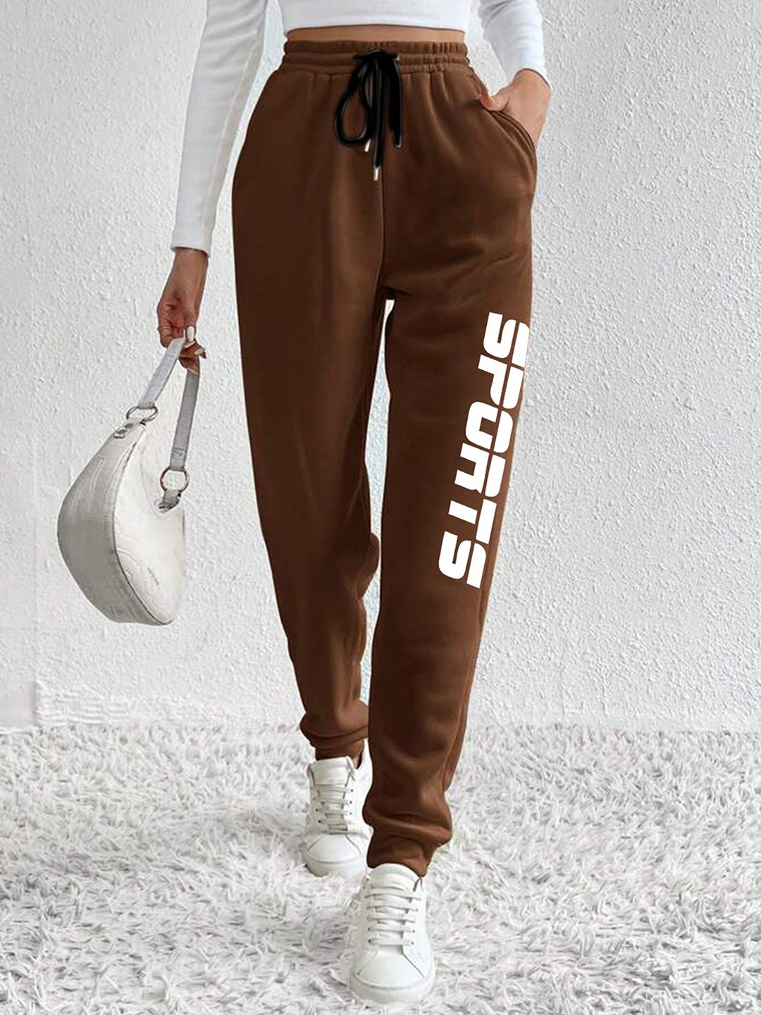

SAAHASAM Women Printed Regular Fit Joggers, Brown
