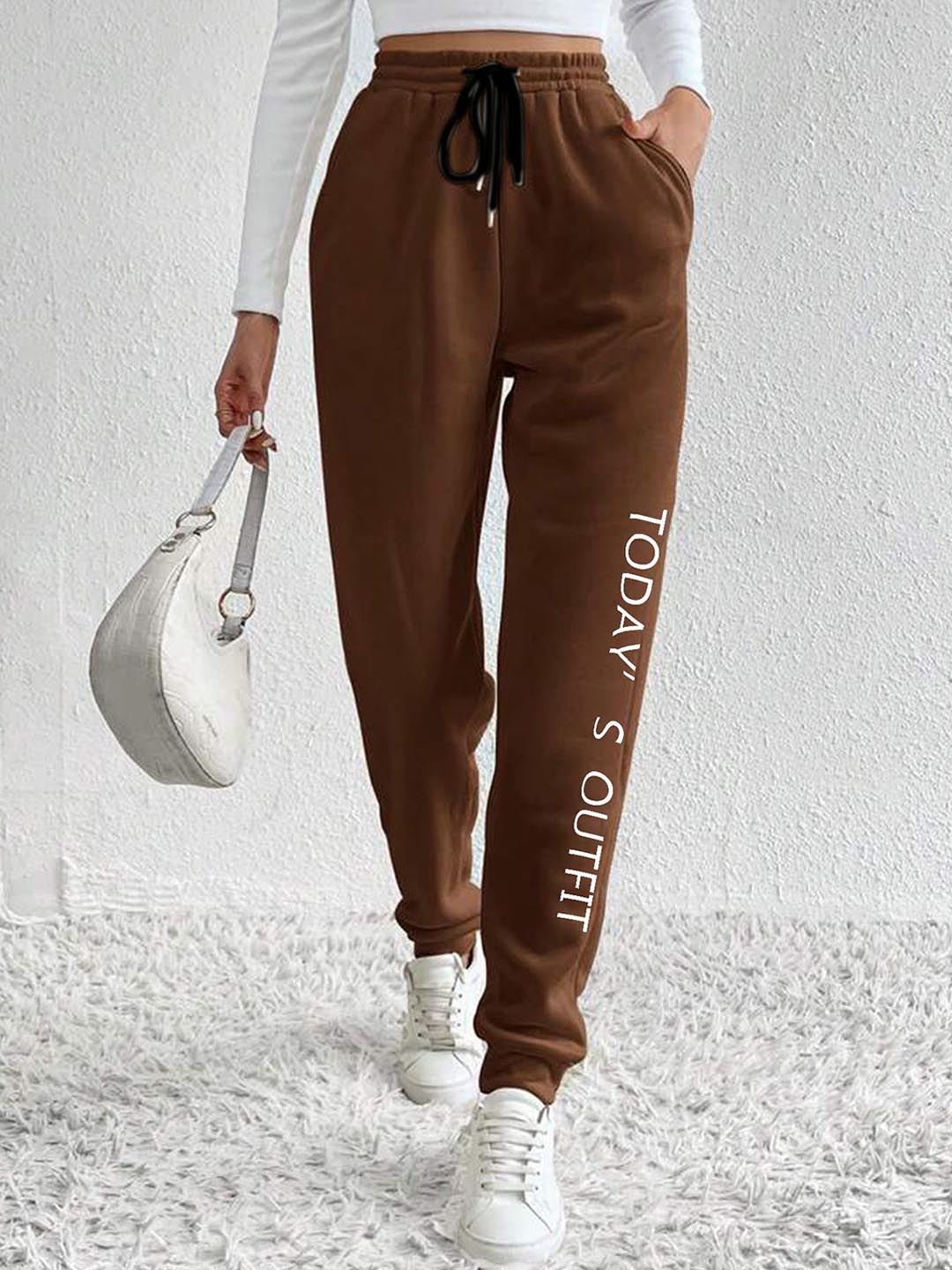 

SAAHASAM Women Printed Relaxed Slim Fit Mid-Rise Joggers Trousers, Brown