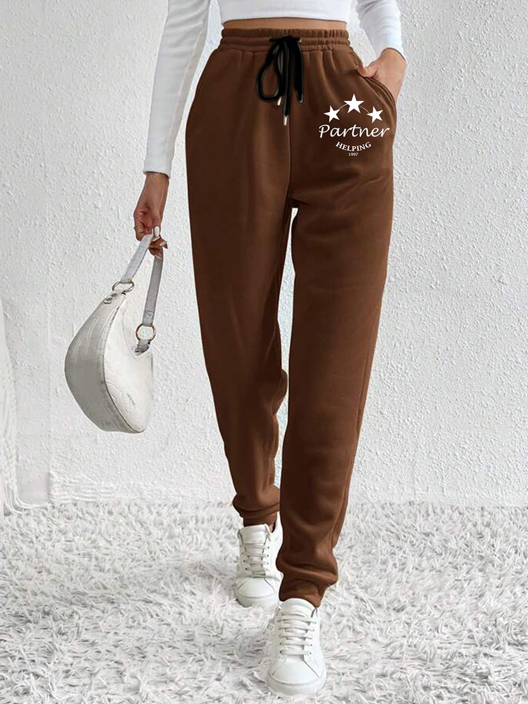 

SAAHASAM Women Printed Relaxed Joggers Trousers, Brown