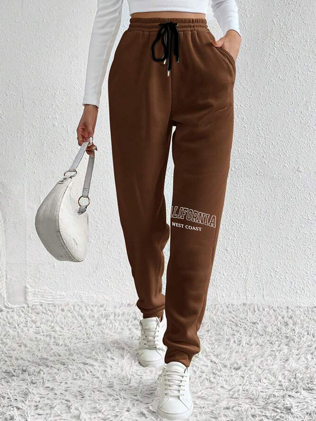 

SAAHASAM Women Printed Relaxed Joggers Trousers, Brown