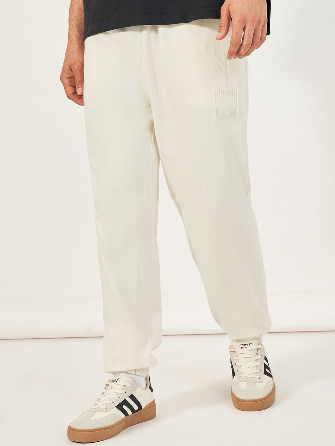 

Styli Men Oversized Fit Jogger with Emboss Print, White