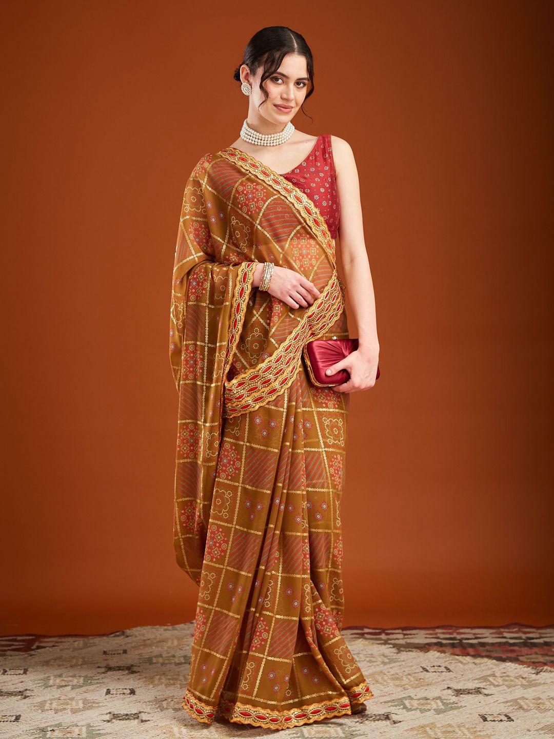 

MAHALASA Ethnic Motifs Printed Embroidered Pure Georgette Bandhani Saree, Mustard