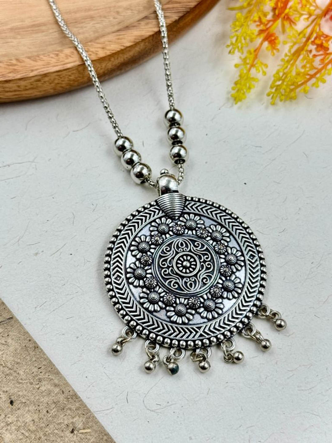 

NAMAN ARTS Silver-Plated Circular Oxidised Pendant With Chain