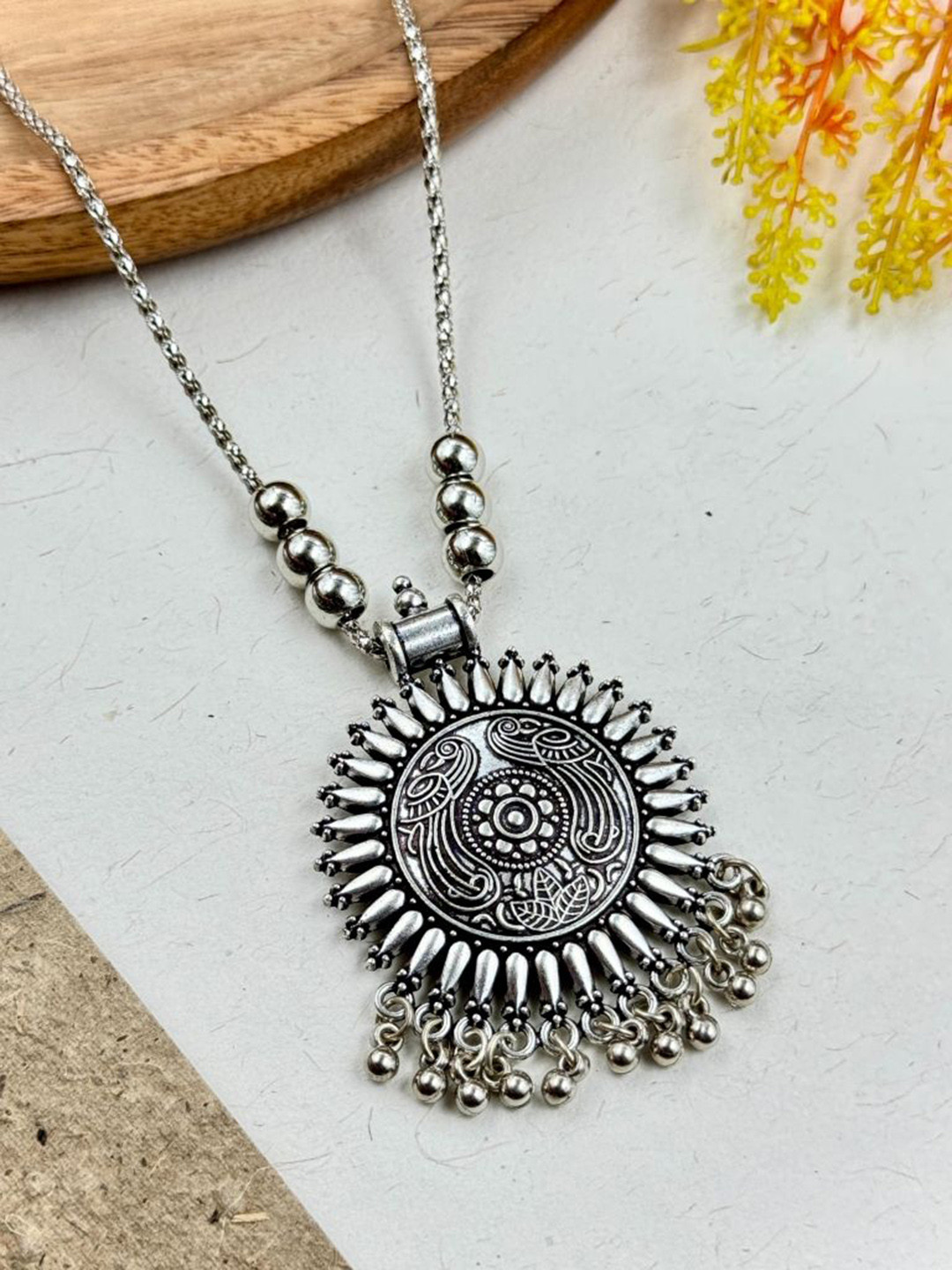 

NAMAN ARTS Silver-Plated Oxidised Circular Pendant With Chain