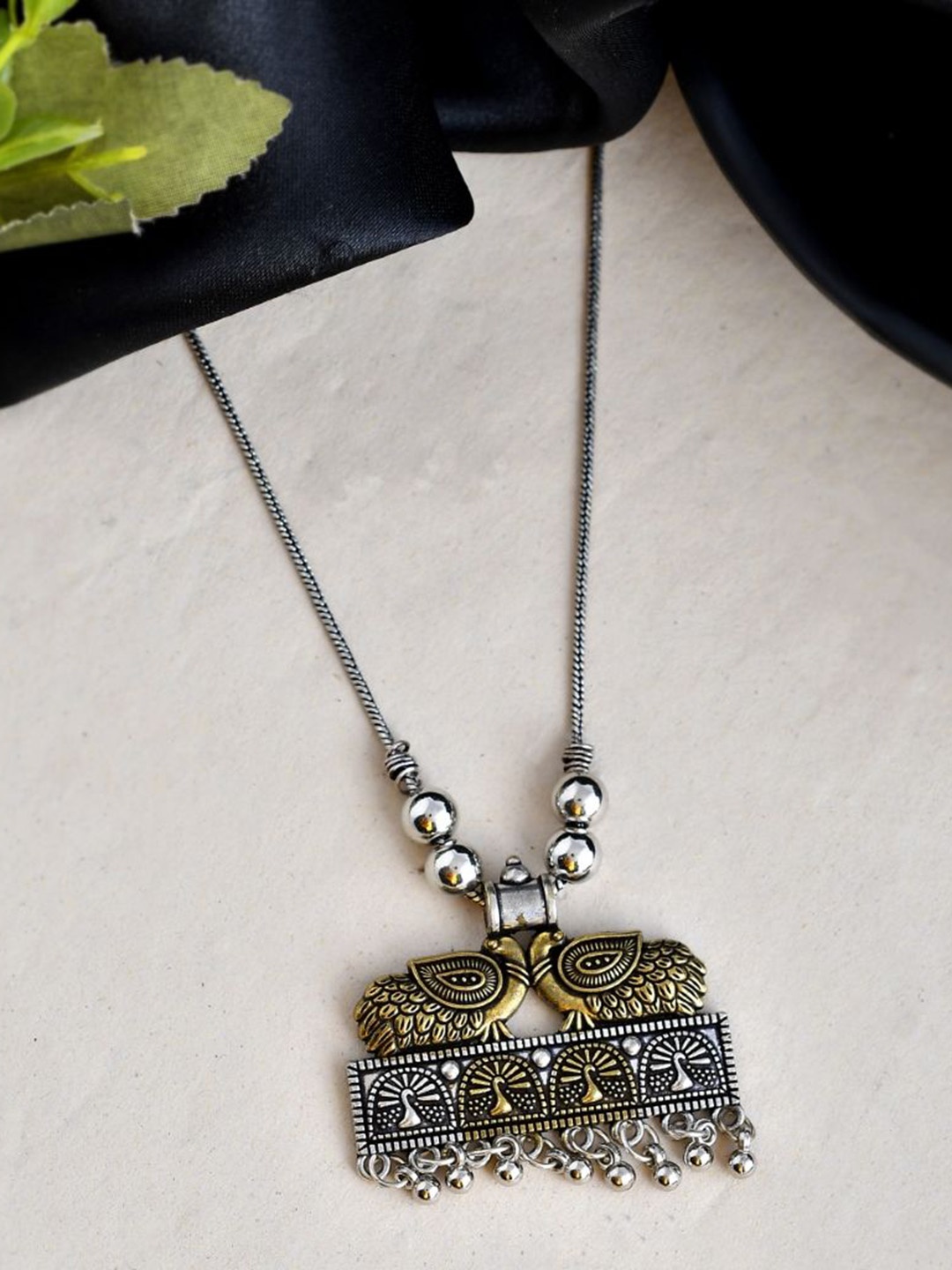 

NAMAN ARTS Gold-Plated Peacock Shaped Oxidised Pendant With Chain