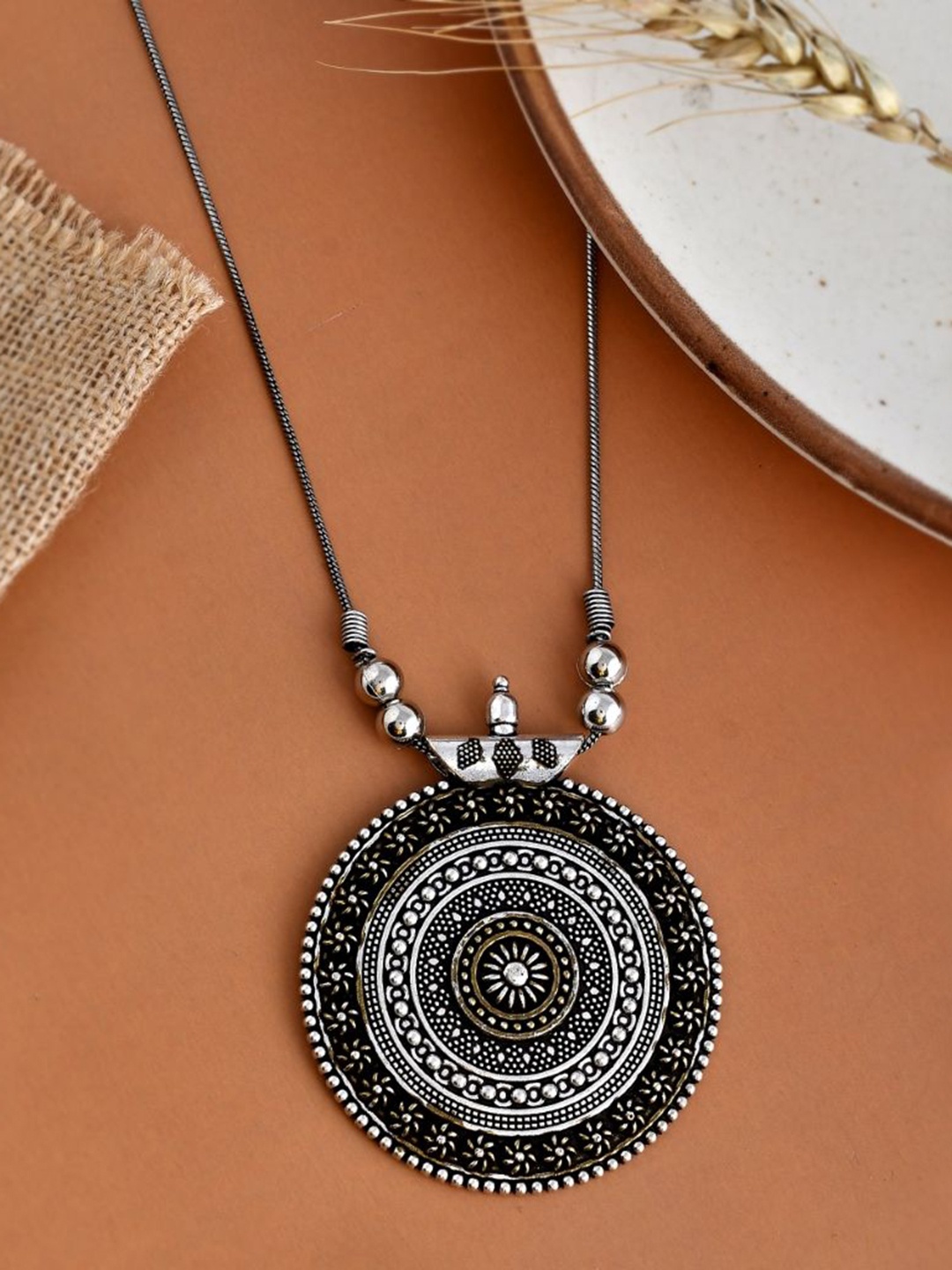 

NAMAN ARTS Silver-Plated Circular Oxidised Pendant With Chain