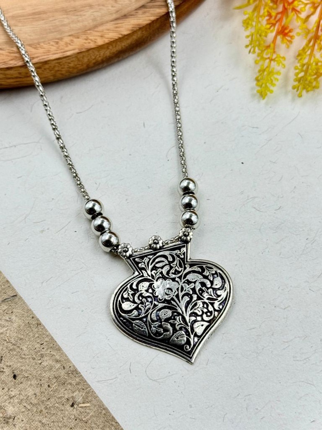 

NAMAN ARTS Silver-Plated Heart Shaped Oxidised Pendant With Chain