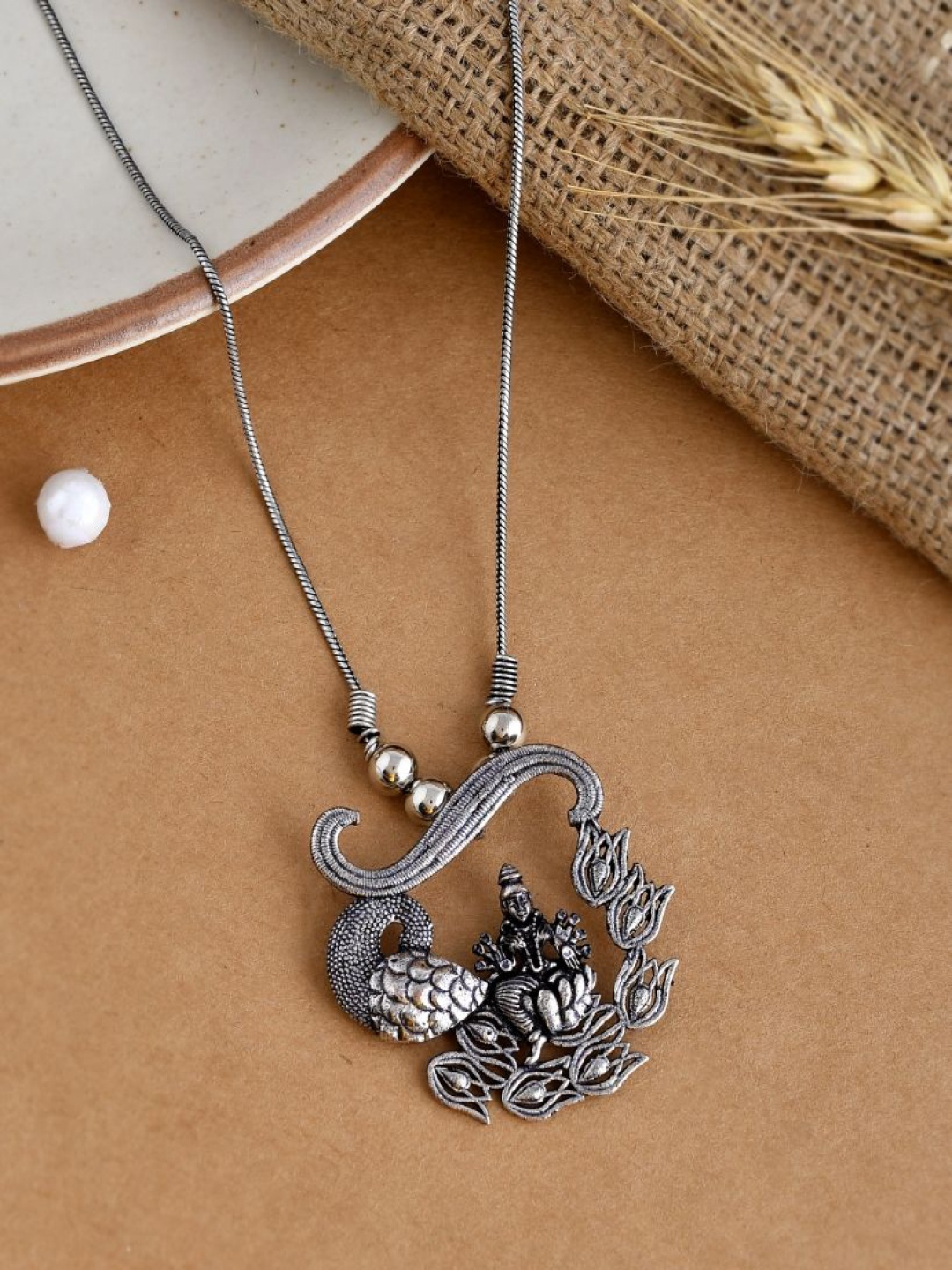 

NAMAN ARTS Silver-Plated Oxidised Goddess Pendant With Chain