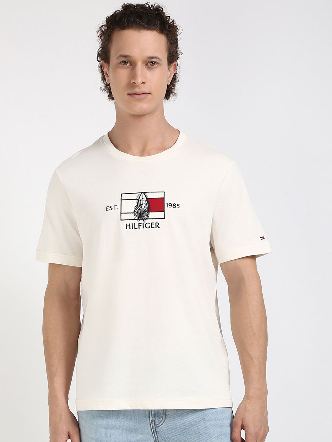 

Tommy Hilfiger Men Graphic Printed Round Neck Cotton T-shirt, Off white