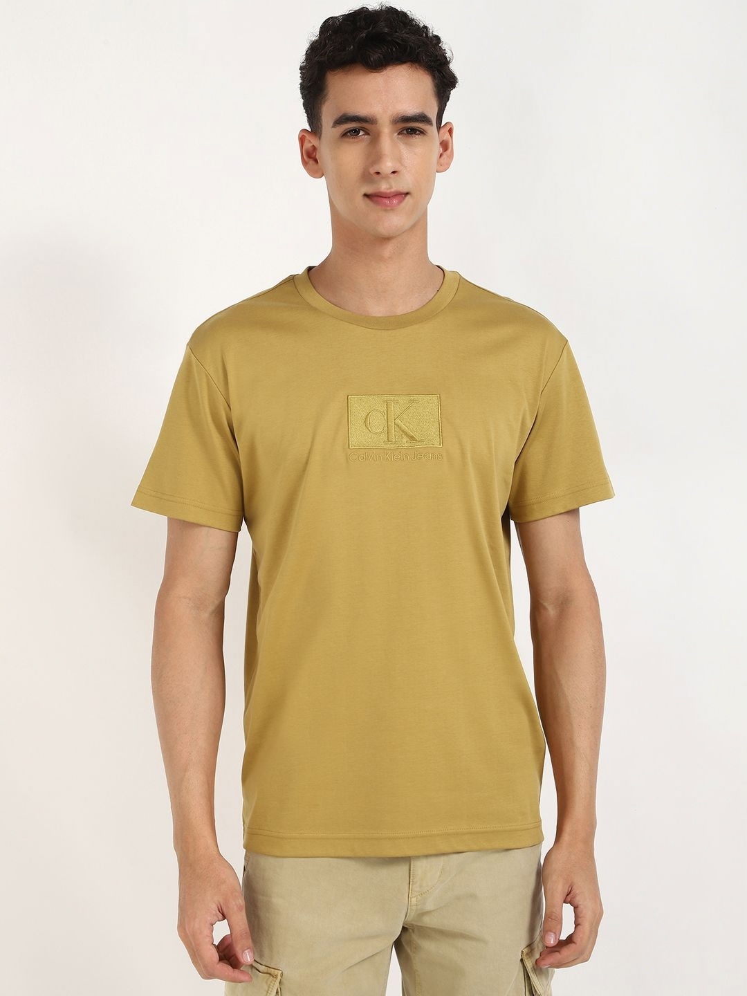 

Calvin Klein Jeans Men Typography Printed Round Neck Cotton T-shirt, Yellow