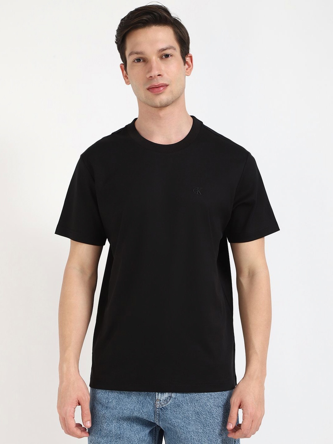 

Calvin Klein Jeans Men Solid Round Neck Cotton T-shirt, Black