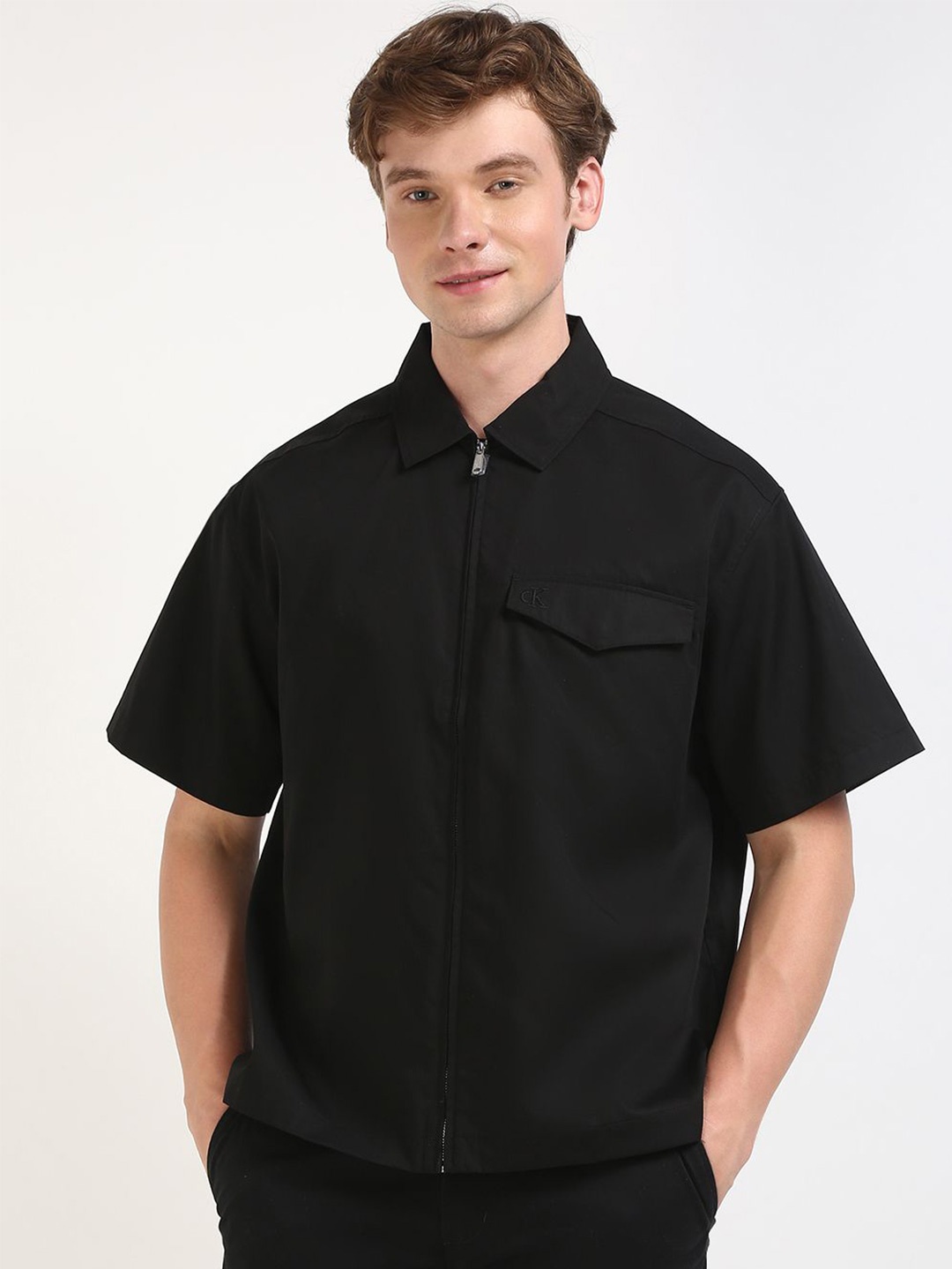 

Calvin Klein Jeans Men Relaxed Fit Spread Collar Solid Cotton Casual Shirt, Black