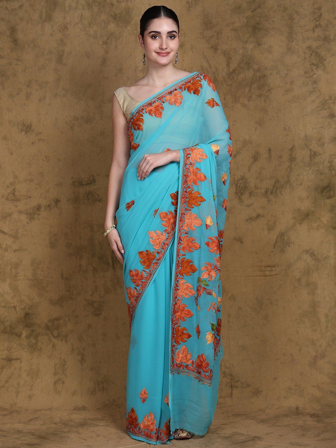 

Exotic India Blue-Curacao Georgette Saree from Kashmir Aari Embroidered Maple Leaves