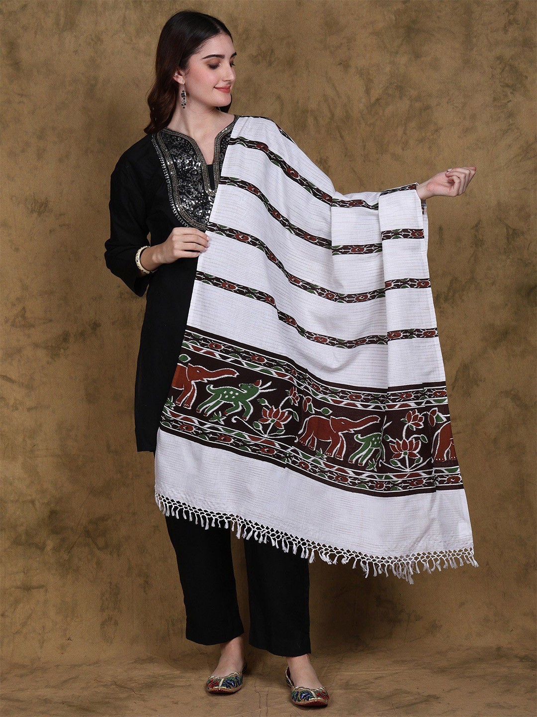 

Exotic India Women Star White Cotton Ikat Dupatta with Printed Jungle Scene Border