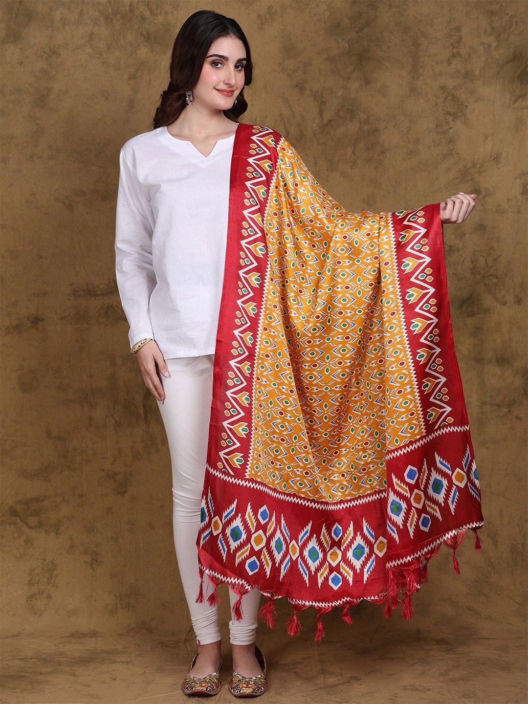 

Exotic India Golden Glow Ikat Print Art Silk Dupatta with Fringes, Yellow