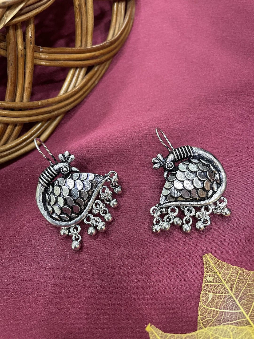

Digital Dress Room German Silver Peacock Shaped Oxidised Drop Earrings