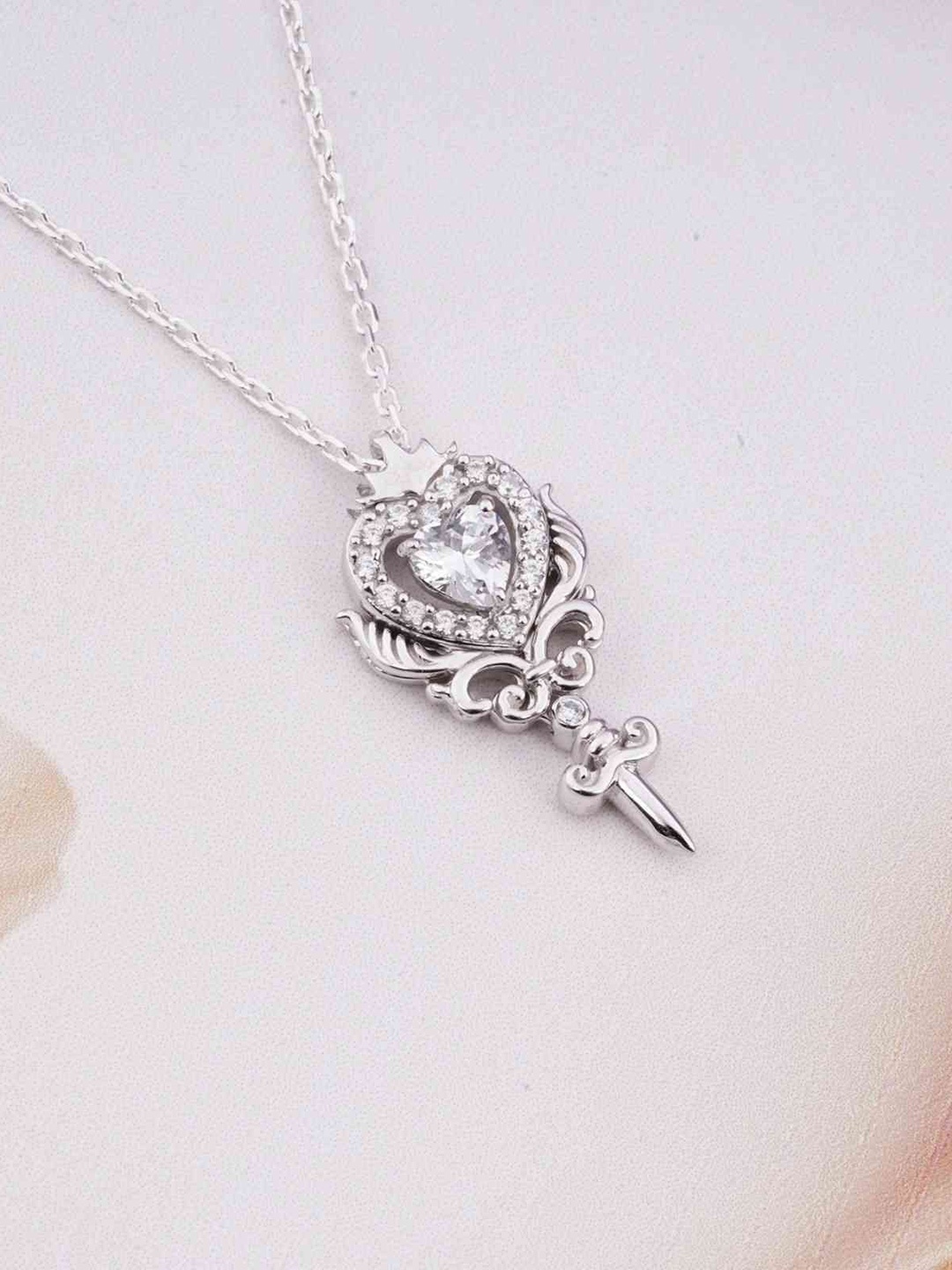 

Zalkari Sterling Silver Rhodium-Plated Cubic Zirconia Studded Heart Weapon Pendant
