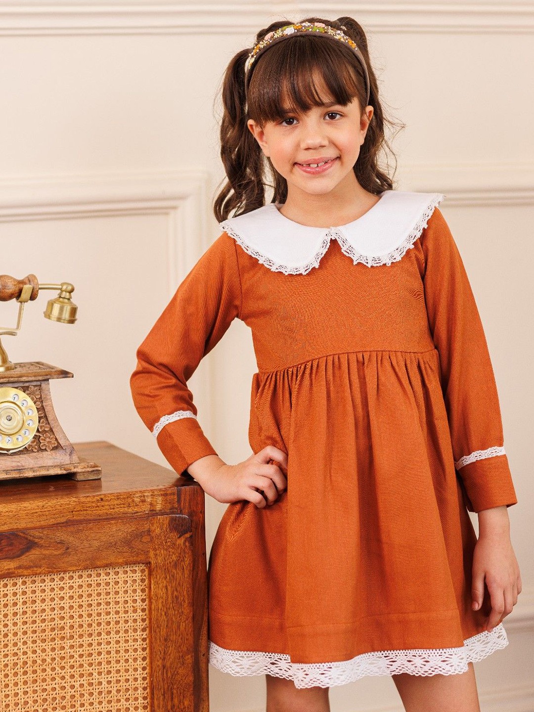 

Arsya Girls Peter Pan Collar Pure Cotton Empire Above Knee Dress, Rust