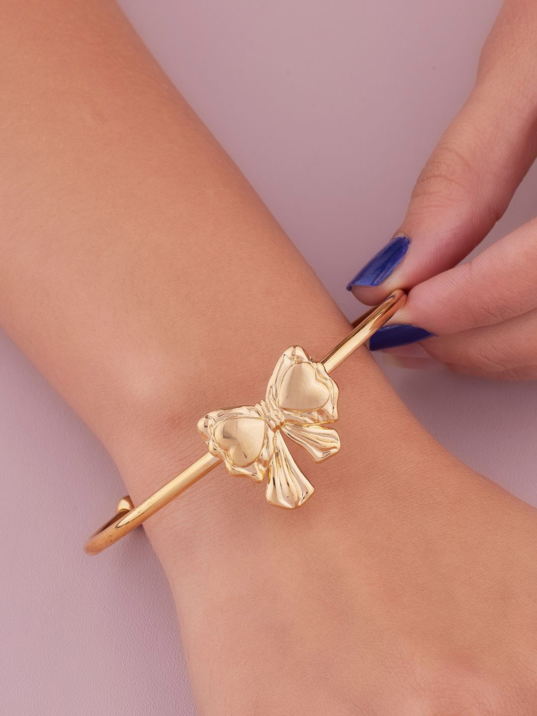 

ANJNI CREATION Gold-Plated Stainless Steel Tarnish-Free Bow Cuff Bracelet