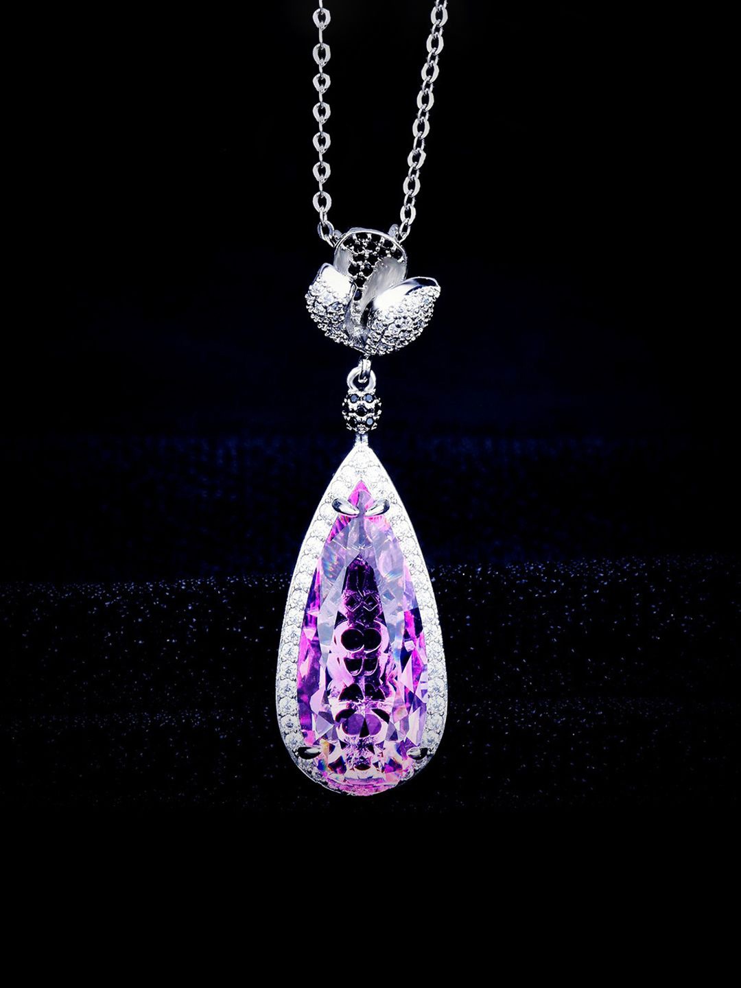 

Jewels Galaxy Silver-Plated American Diamond Studded Teardrop Shaped Pendant With Chain