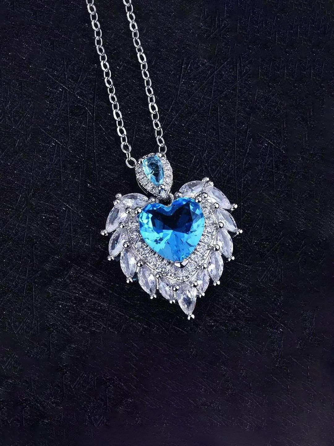 

Jewels Galaxy Silver Plated AD & Cubic Zirconia Studded Feather Shaped Pendant With Chain