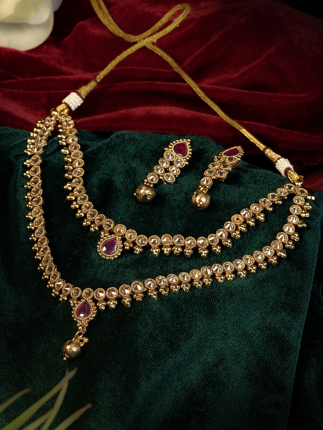 

GOLD CASH Women Gold Plated Stone Studded & Beaded Jewellery Set